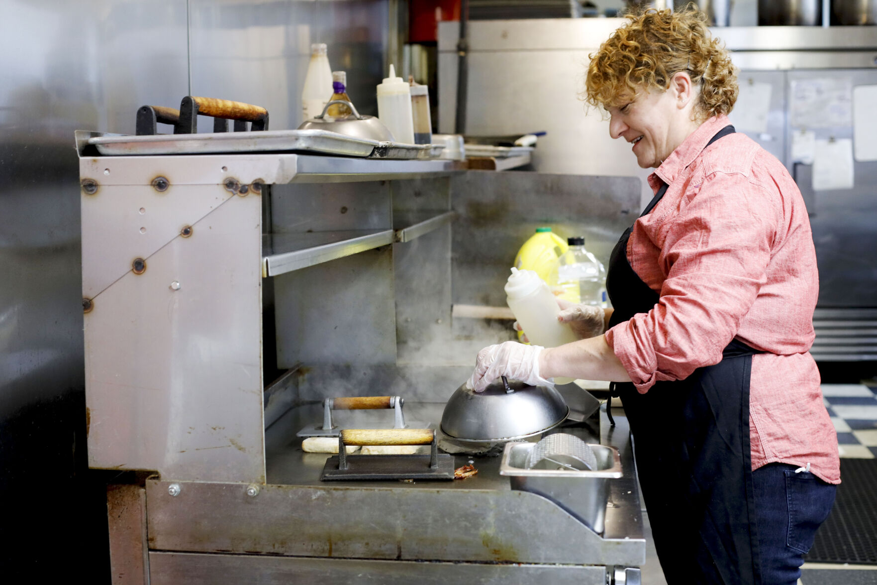 chef cooking on kitchen grill
